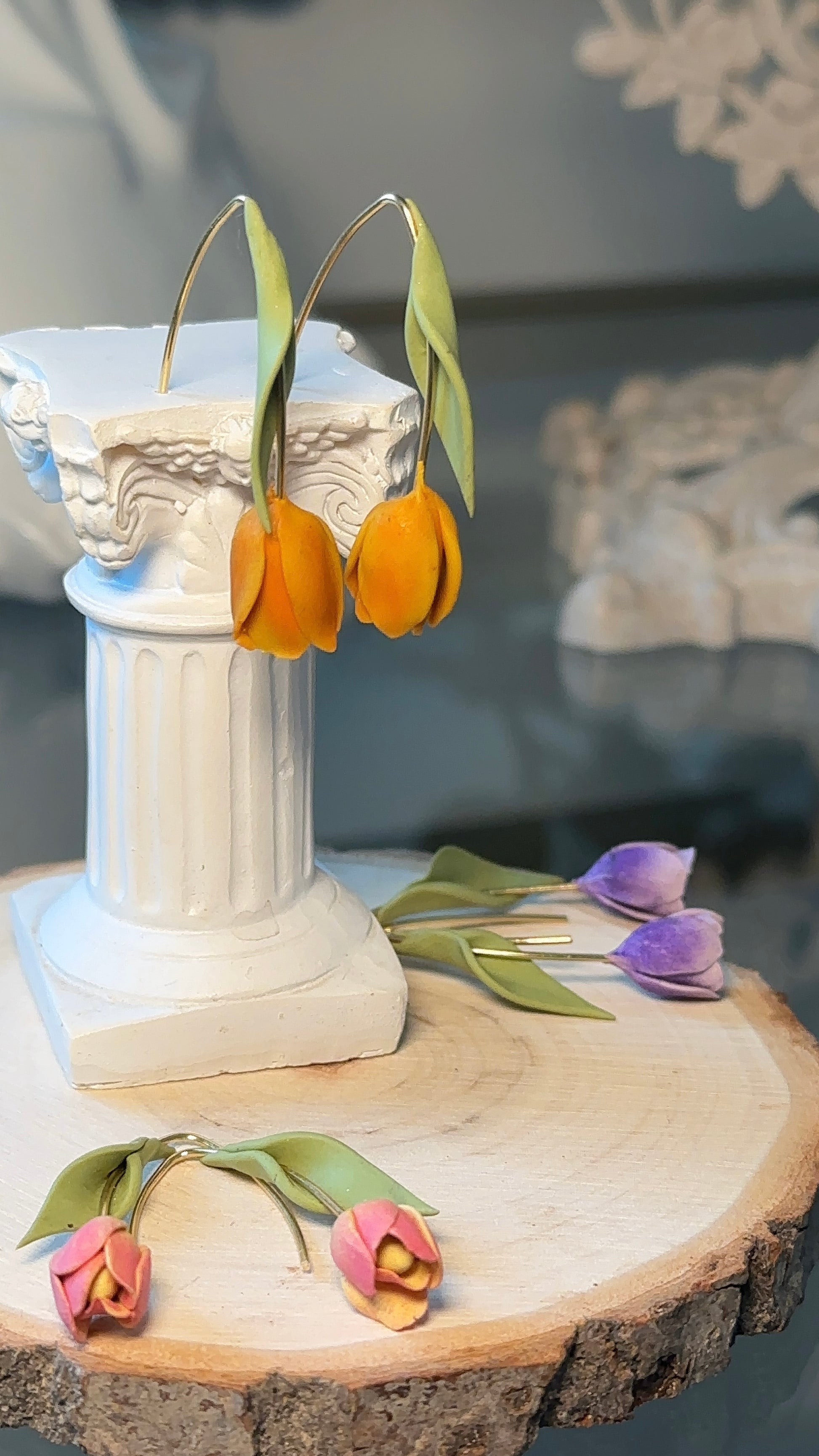 Pair of tulip earrings photographed on neutral background – minimalist and nature-inspired jewelry