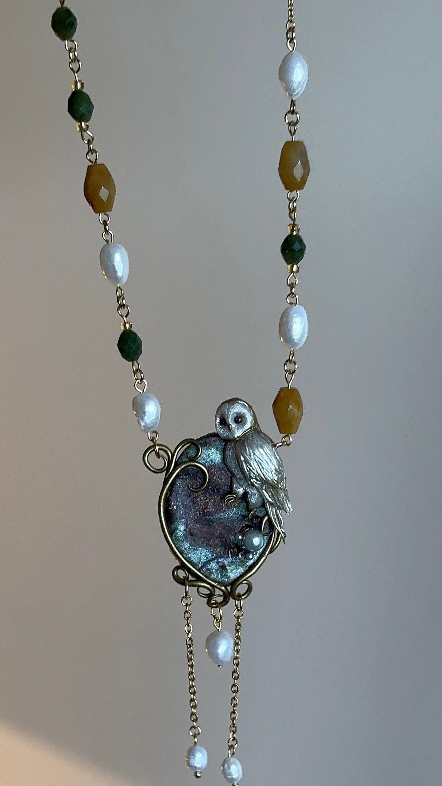 Handmade designer jewelry with polymer clay owl, natural stones, and hypoallergenic stainless steel chain.