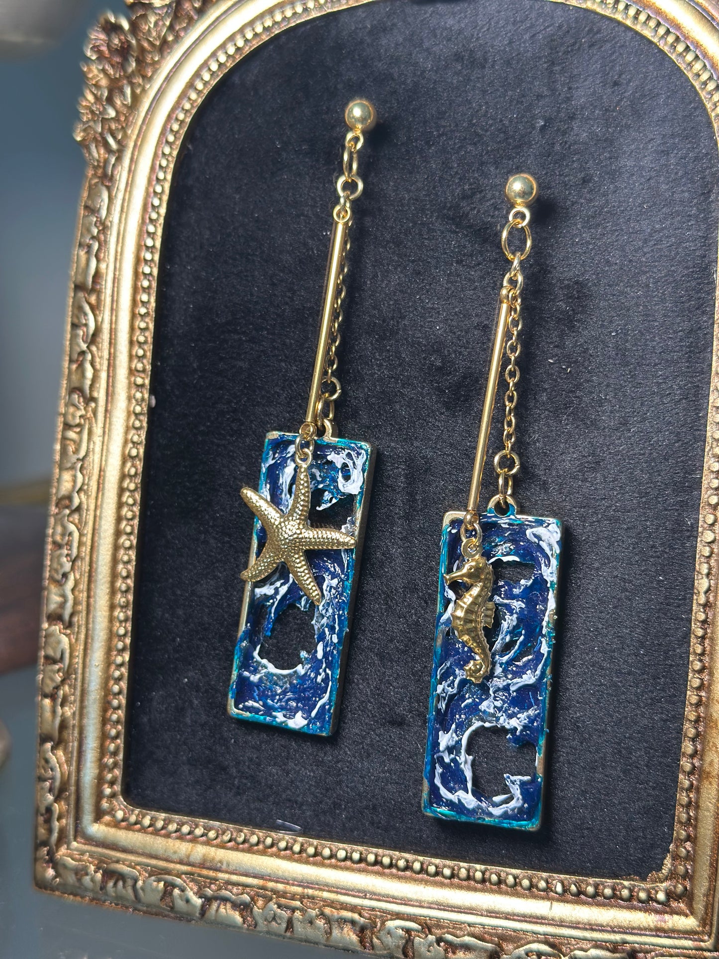 Elegant handcrafted earrings with ocean wave textures and gold stainless steel details