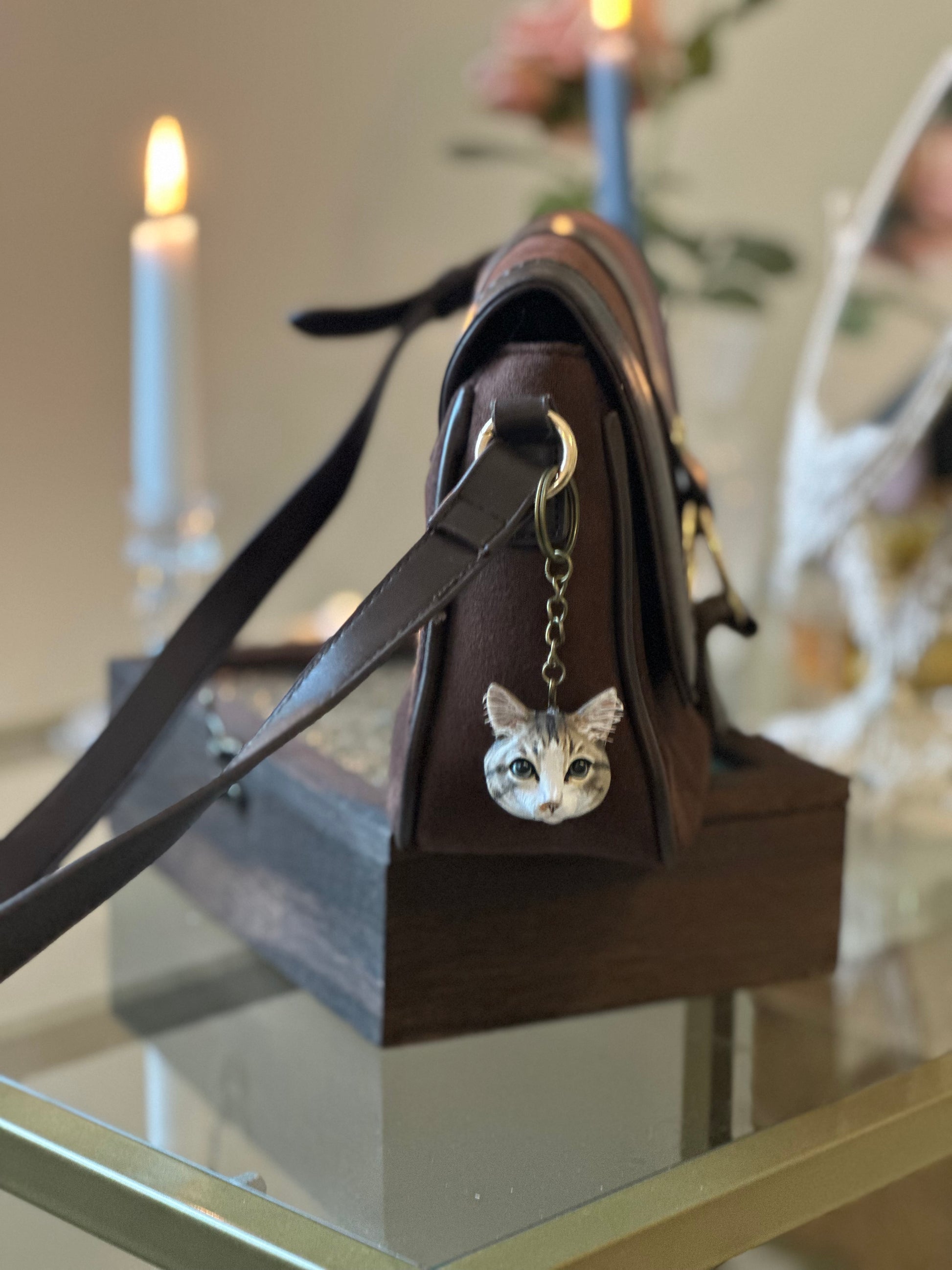 Custom cat face keychain, hand-sculpted in polymer clay as a personalized pet portrait keepsake. Unique miniature sculpture, waterproof and durable.