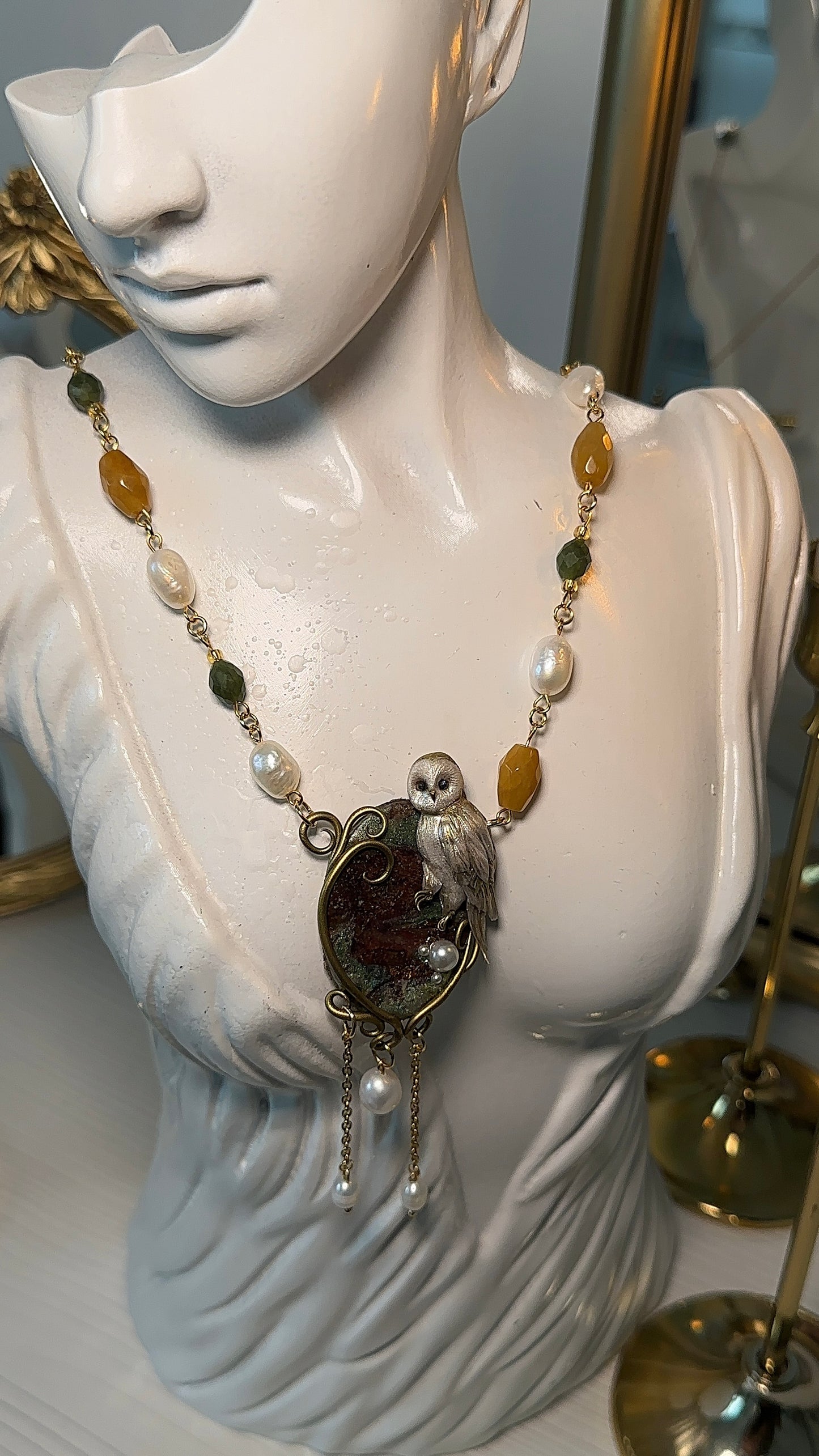 Unique handcrafted owl pendant with real pearls and gemstones, designed for those who collect emotional and elegant jewelry.