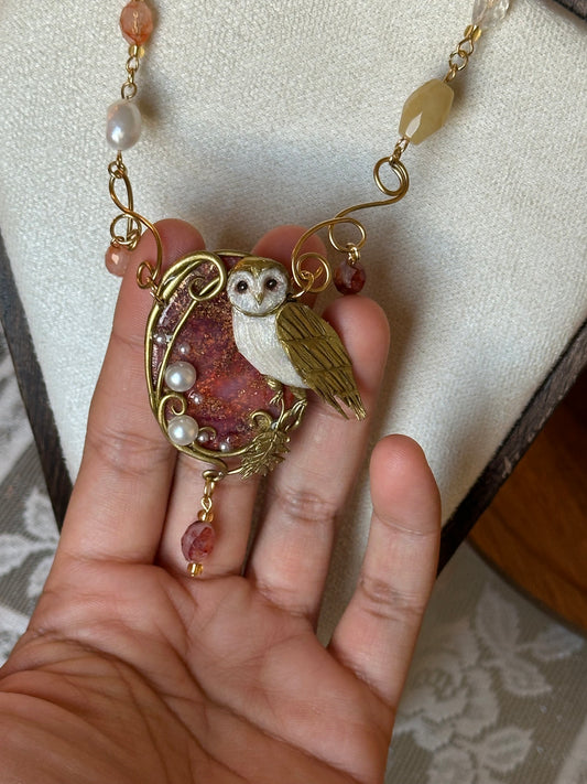 Handmade owl necklace with golden wing, natural pearls, and quartz – artistic statement jewelry for women