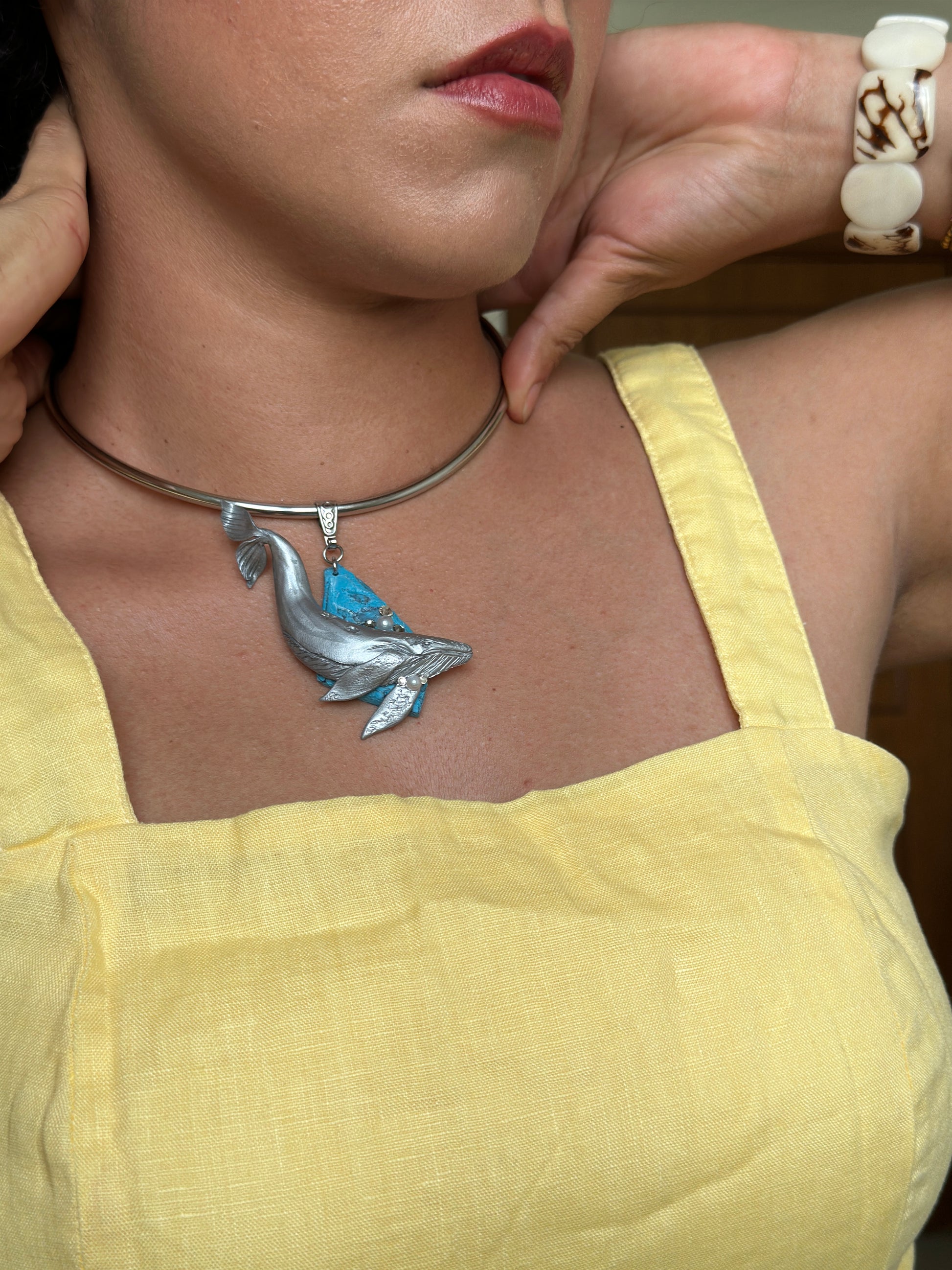     Handmade silver whale statement necklace with faux turquoise stone, ocean inspired sculptural pendant for women’s summer outfits.