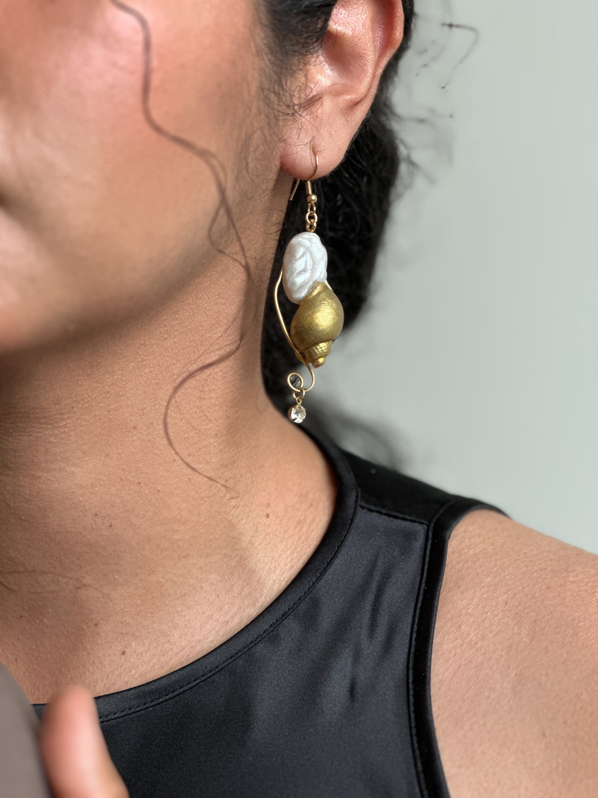     Gold and pearl ocean earrings with sculptural crab and shell details, perfect for adding a strange, elegant little story to a clean summer outfit.