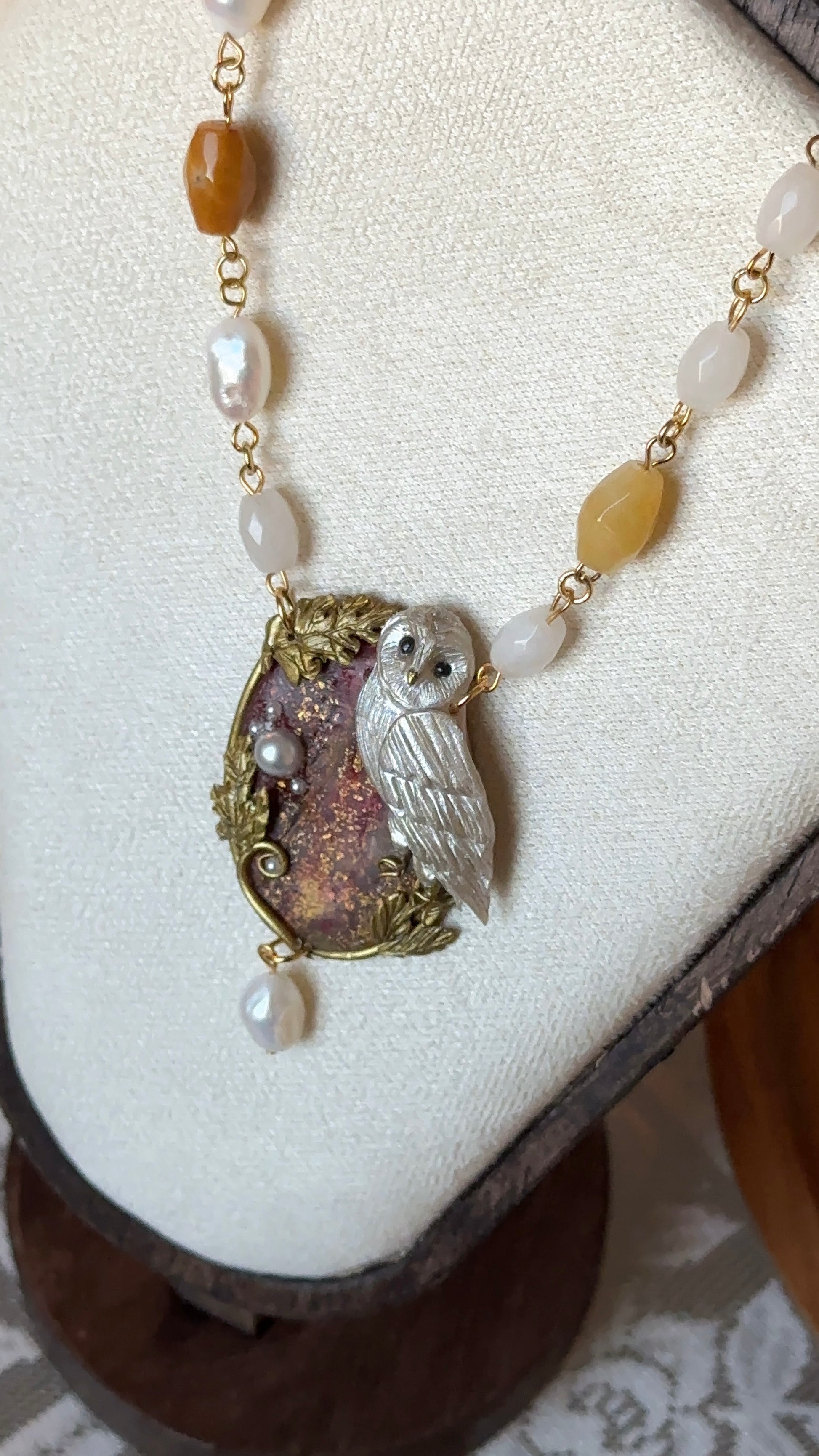 Unique owl necklace with pearls and golden touches – artisan statement jewelry.