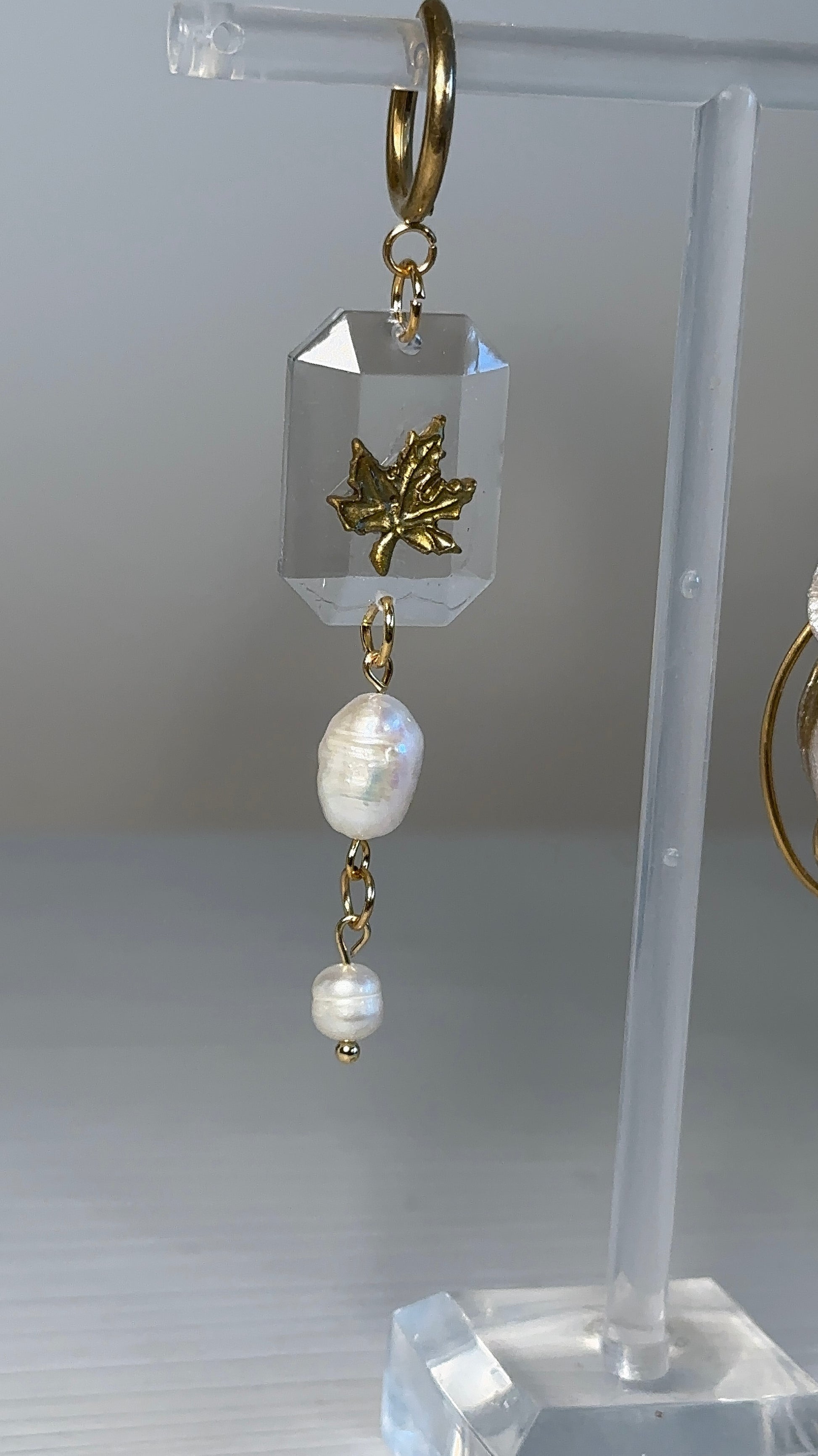 Golden owl and maple leaf statement earrings made with polymer clay and resin, inspired by autumn elegance and asymmetry.