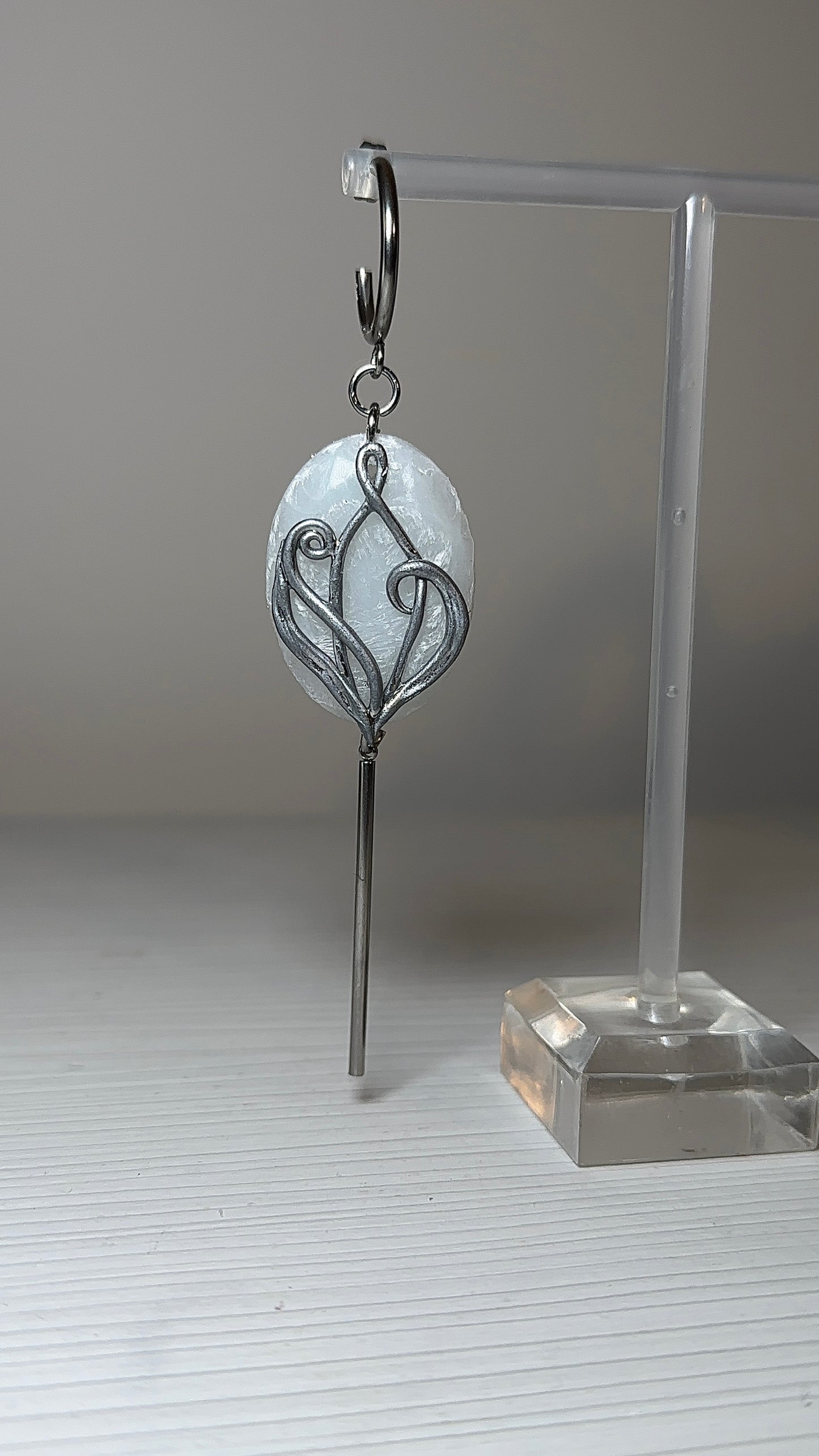 Art Nouveau inspired silver earrings with sculptural organic design and soft icy translucence, statement jewelry for quiet luxury style