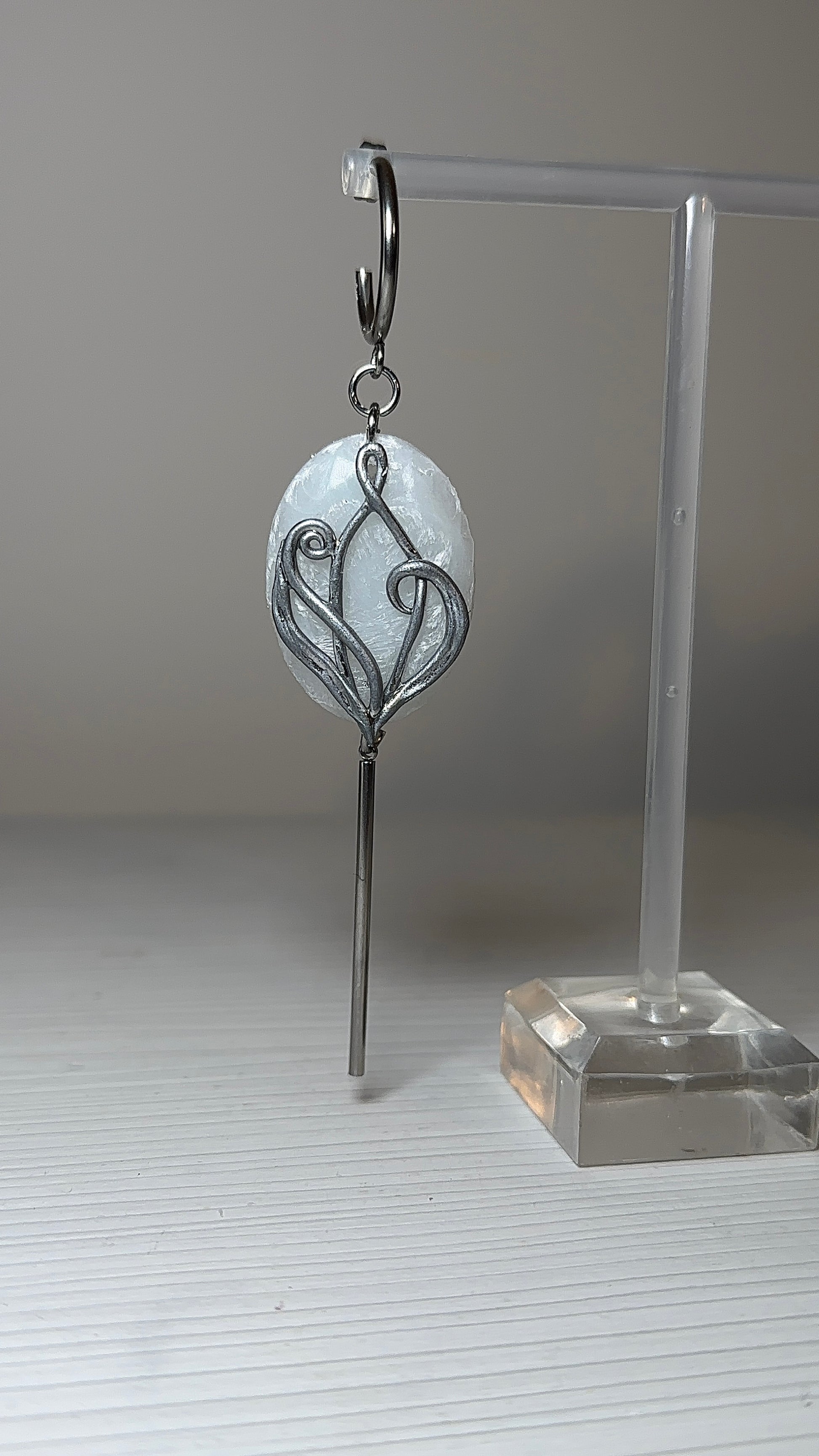 Art Nouveau inspired silver earrings with sculptural organic design and soft icy translucence, statement jewelry for quiet luxury style