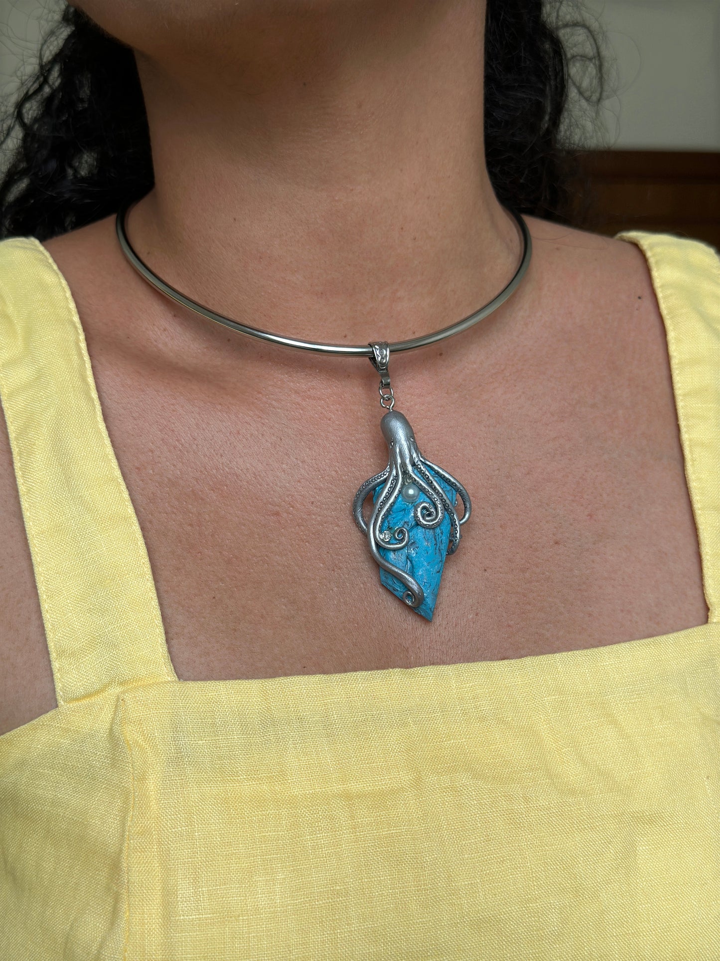        One of a kind silver octopus pendant necklace with faux turquoise base, artistic ocean jewelry for collectors of statement accessories.