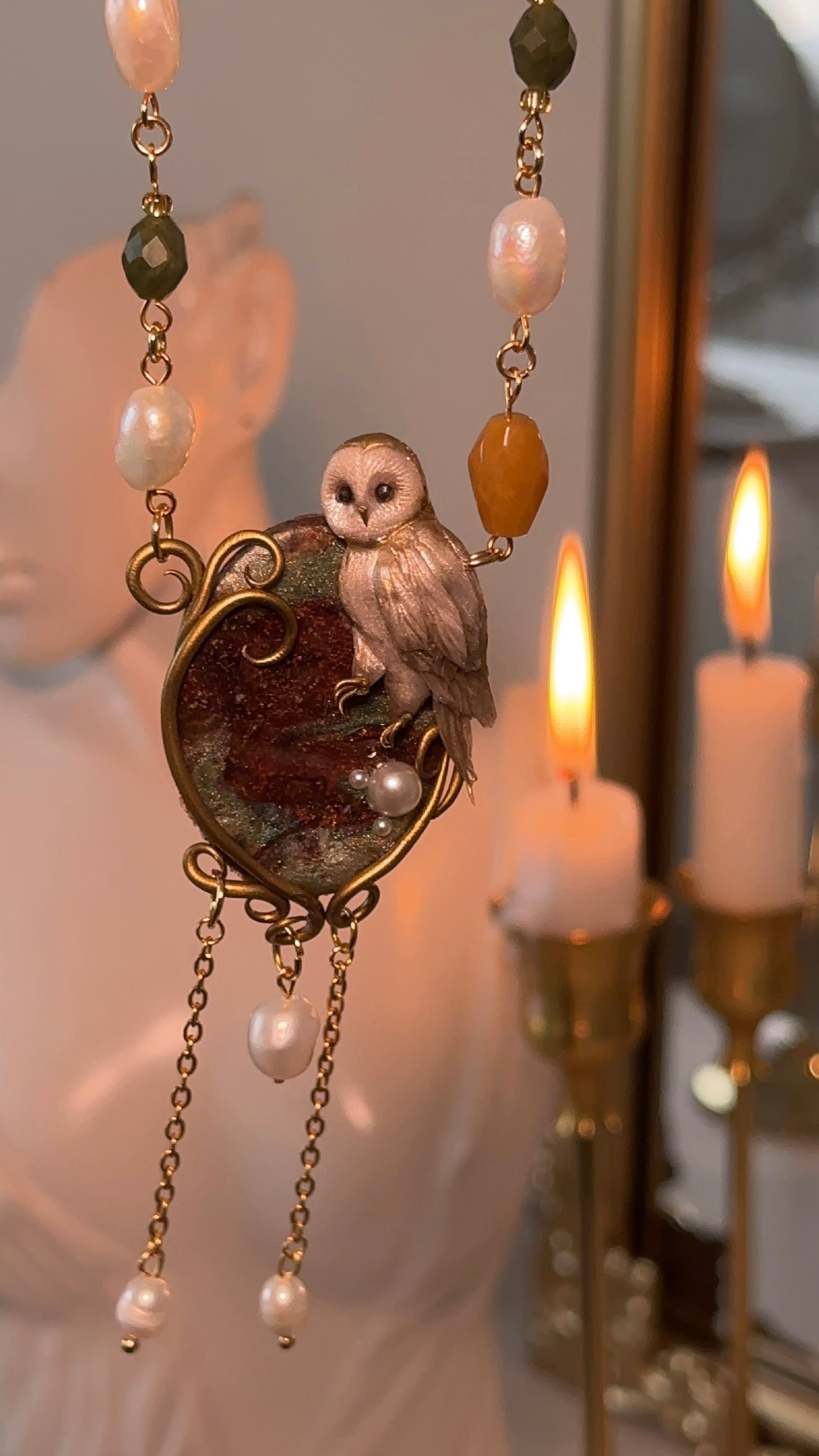 Hand-sculpted owl pendant necklace with natural pearls and real gemstones — an elegant statement piece of wearable art.