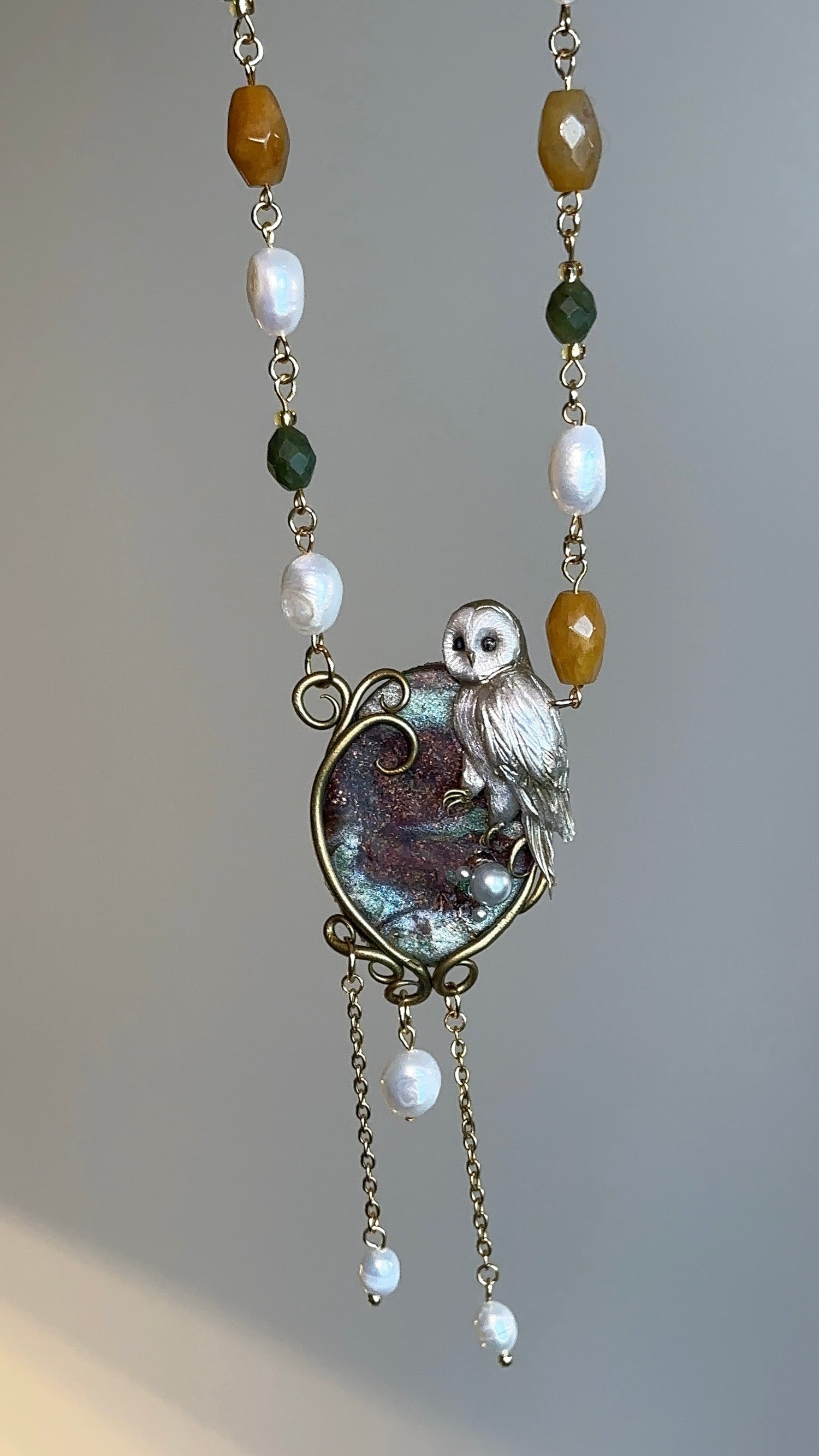 Artistic owl necklace with freshwater pearls and natural stones, luxury handmade jewelry crafted in Italy
