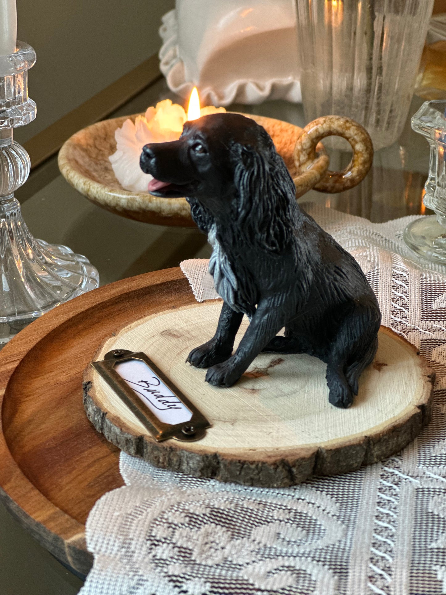 Hand-sculpted black Spaniel dog memorial statue in cold porcelain, custom lifelike pet sculpture on wooden base with engraved nameplate “Buddy