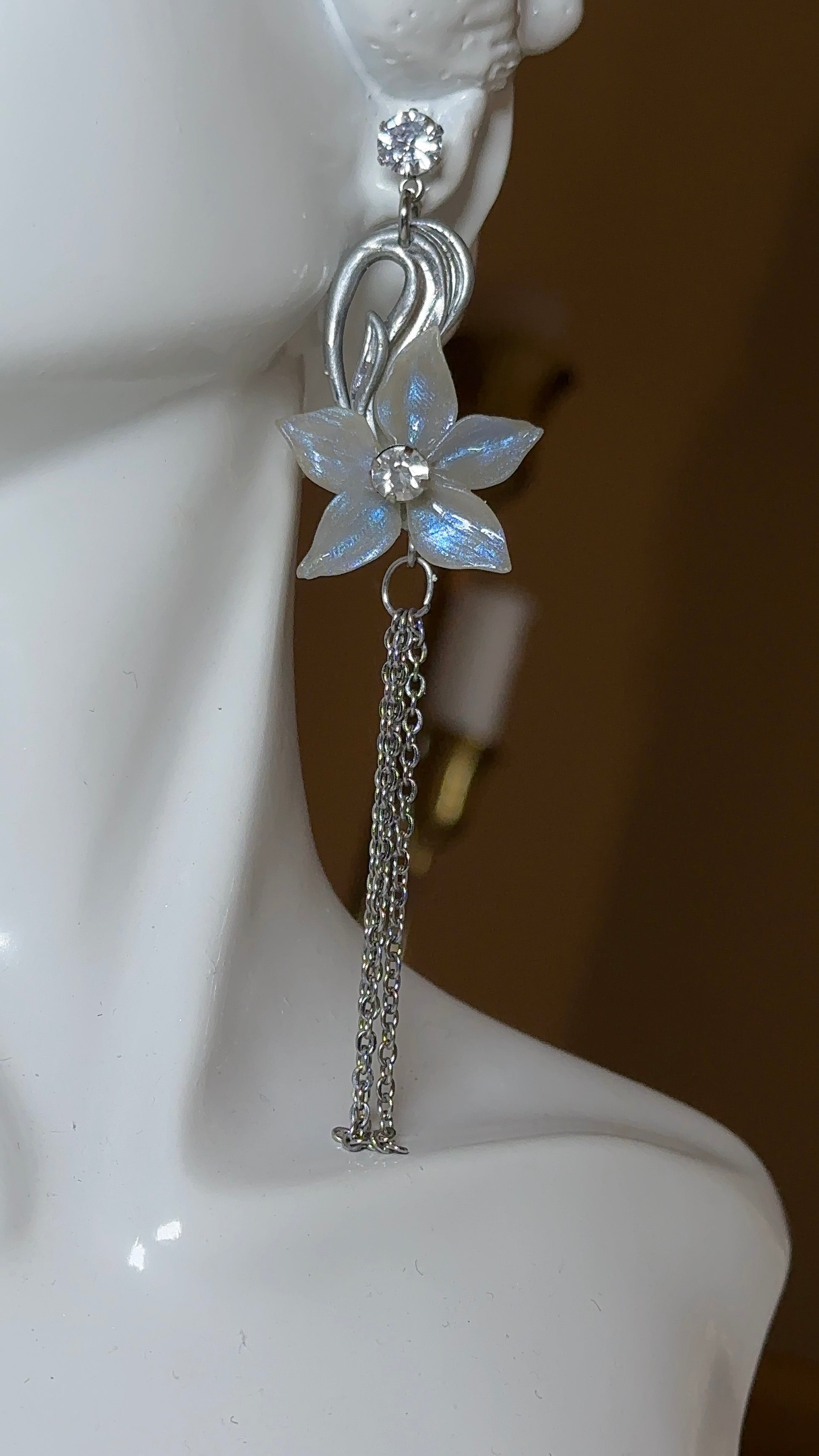 Poetic floral drop earrings with translucent flowers and silver accents, designed for women who love timeless, elegant, and expressive jewellery.