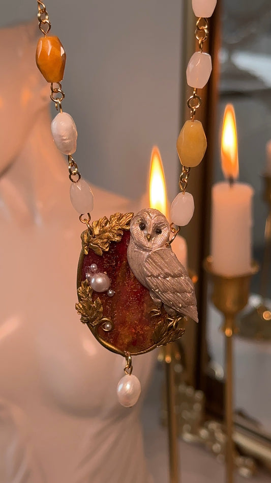 Handcrafted owl necklace with natural pearls, real gemstones and gold details — a luxurious piece of wearable art inspired by autumn nights.