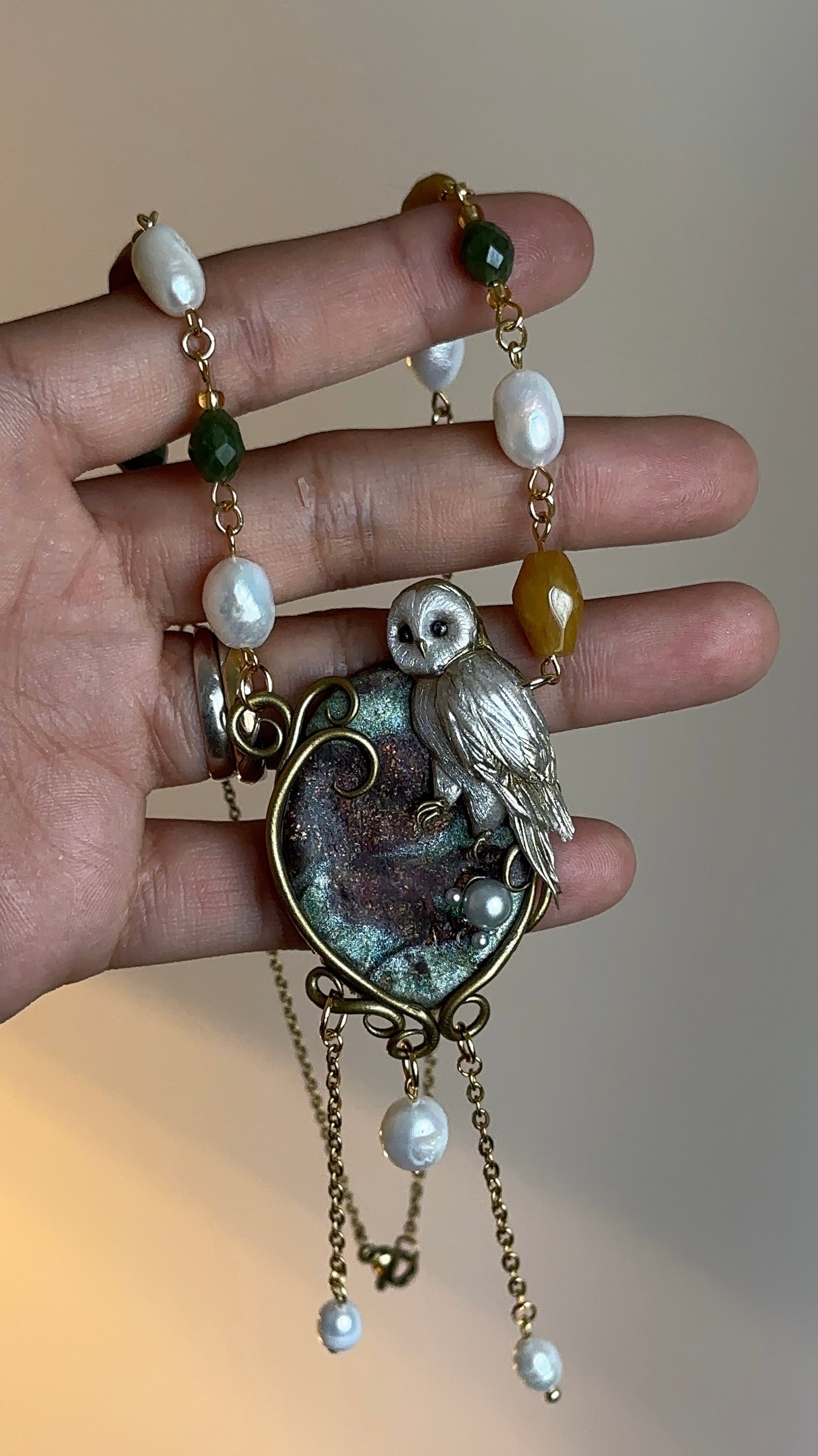 Exclusive owl necklace for women – handcrafted in Italy with pearls and natural gemstones, artistic jewelry.
