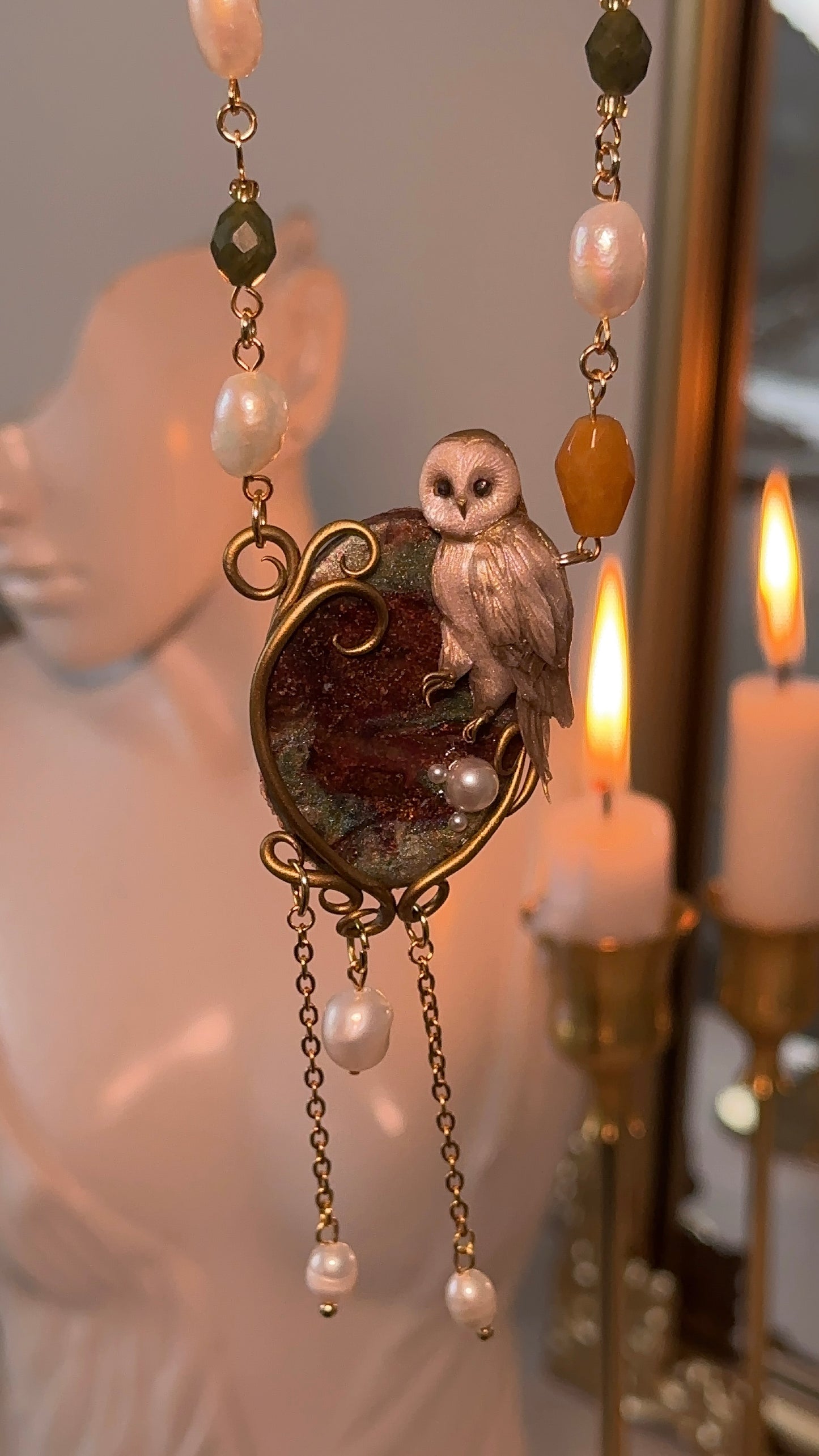 Artistic owl necklace in polymer clay with natural pearls and genuine stones — a timeless, nature-inspired jewelry piece.