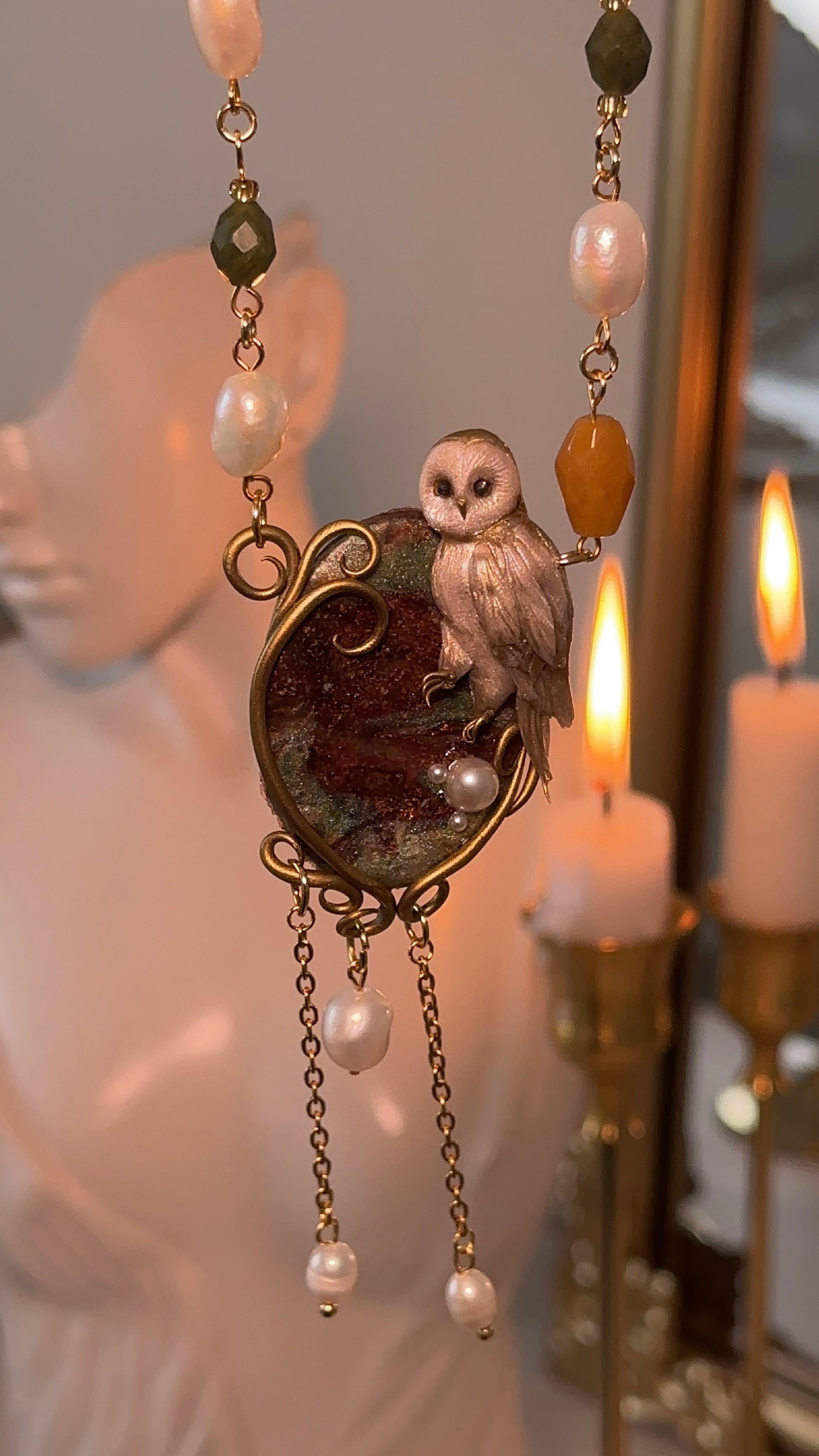 Artistic owl necklace in polymer clay with natural pearls and genuine stones — a timeless, nature-inspired jewelry piece.