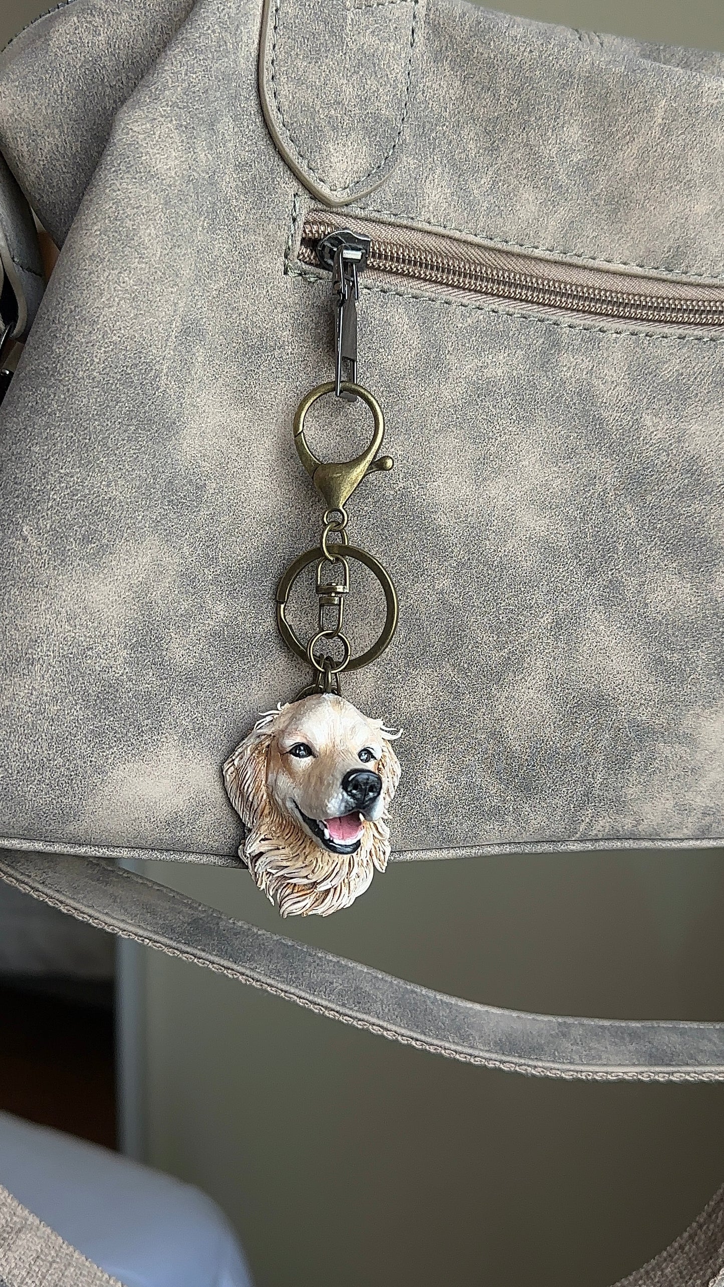 Miniature custom animal sculpture keychain made by hand, capturing the personality of a beloved dog, cat or small pet.