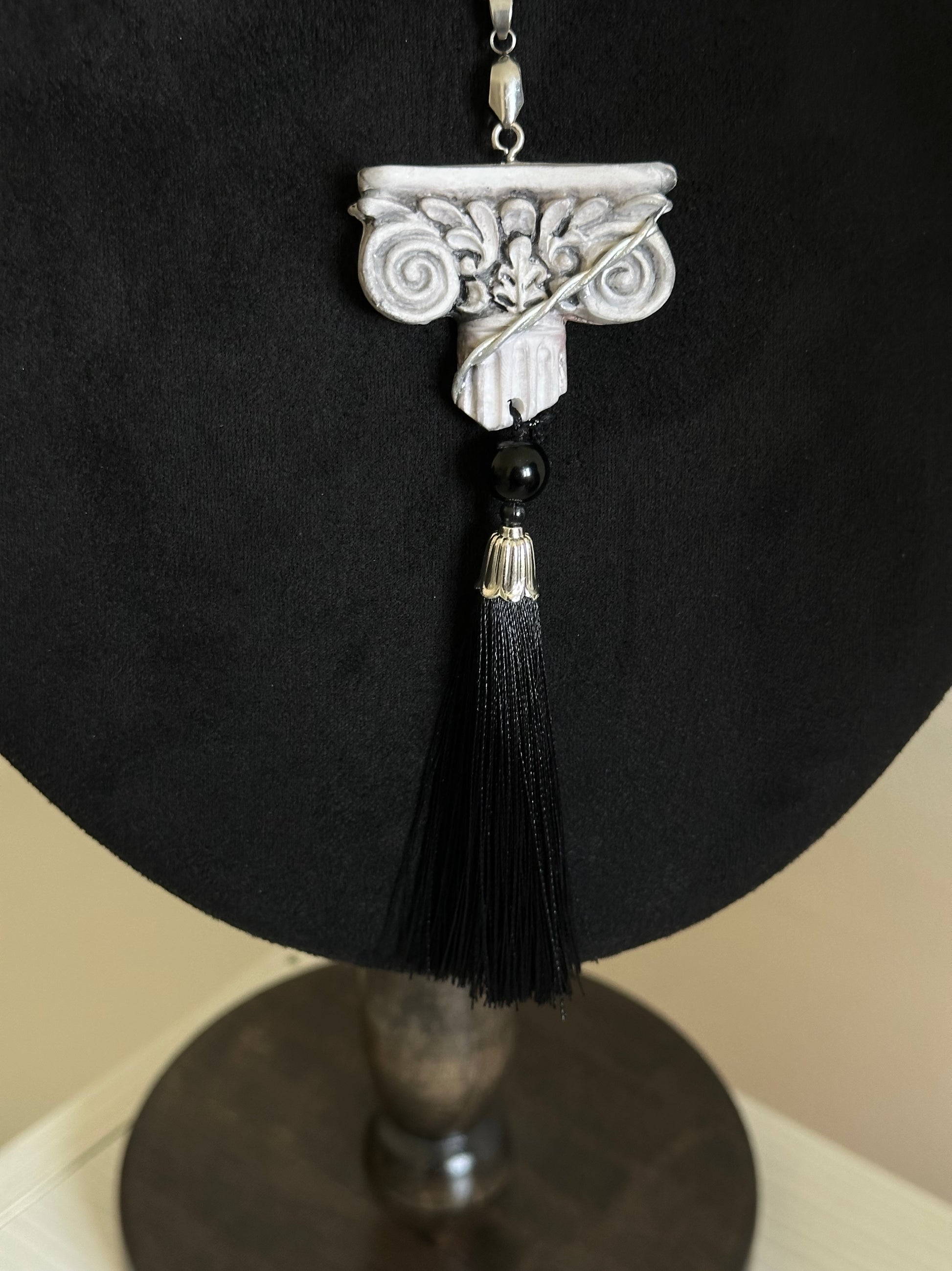     Wearable relic necklace with black thread tassel, dark bead and architectural pendant, unusual statement jewelry for elegant dramatic style.