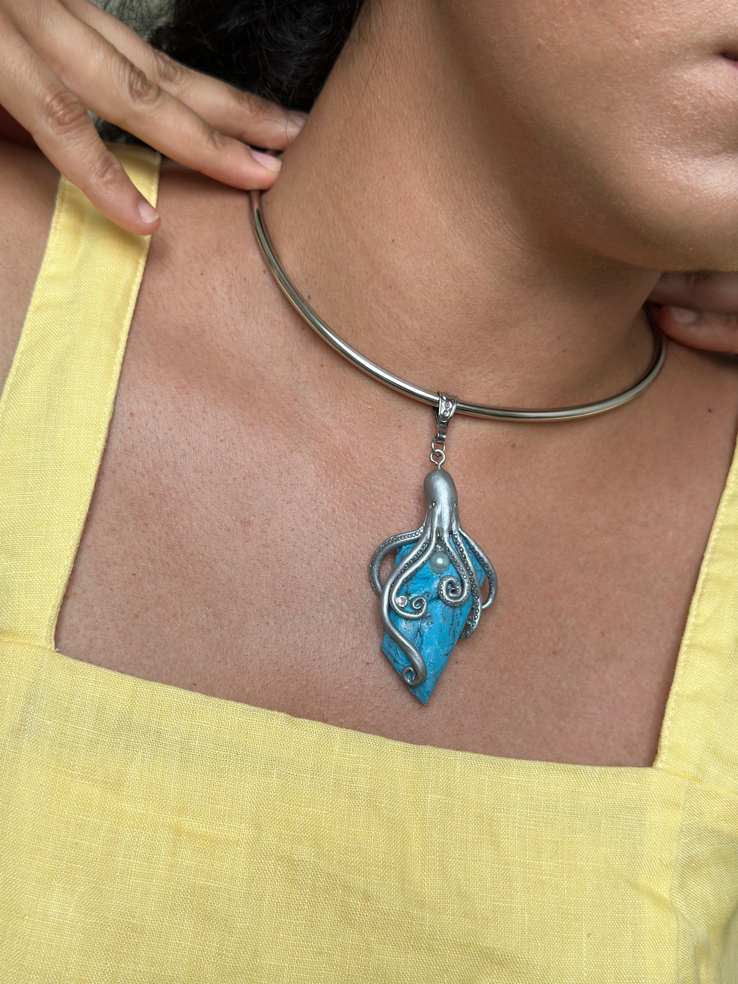     Handmade silver octopus statement necklace with faux turquoise pendant, ocean inspired sculptural jewelry for women who love unusual accessories.
