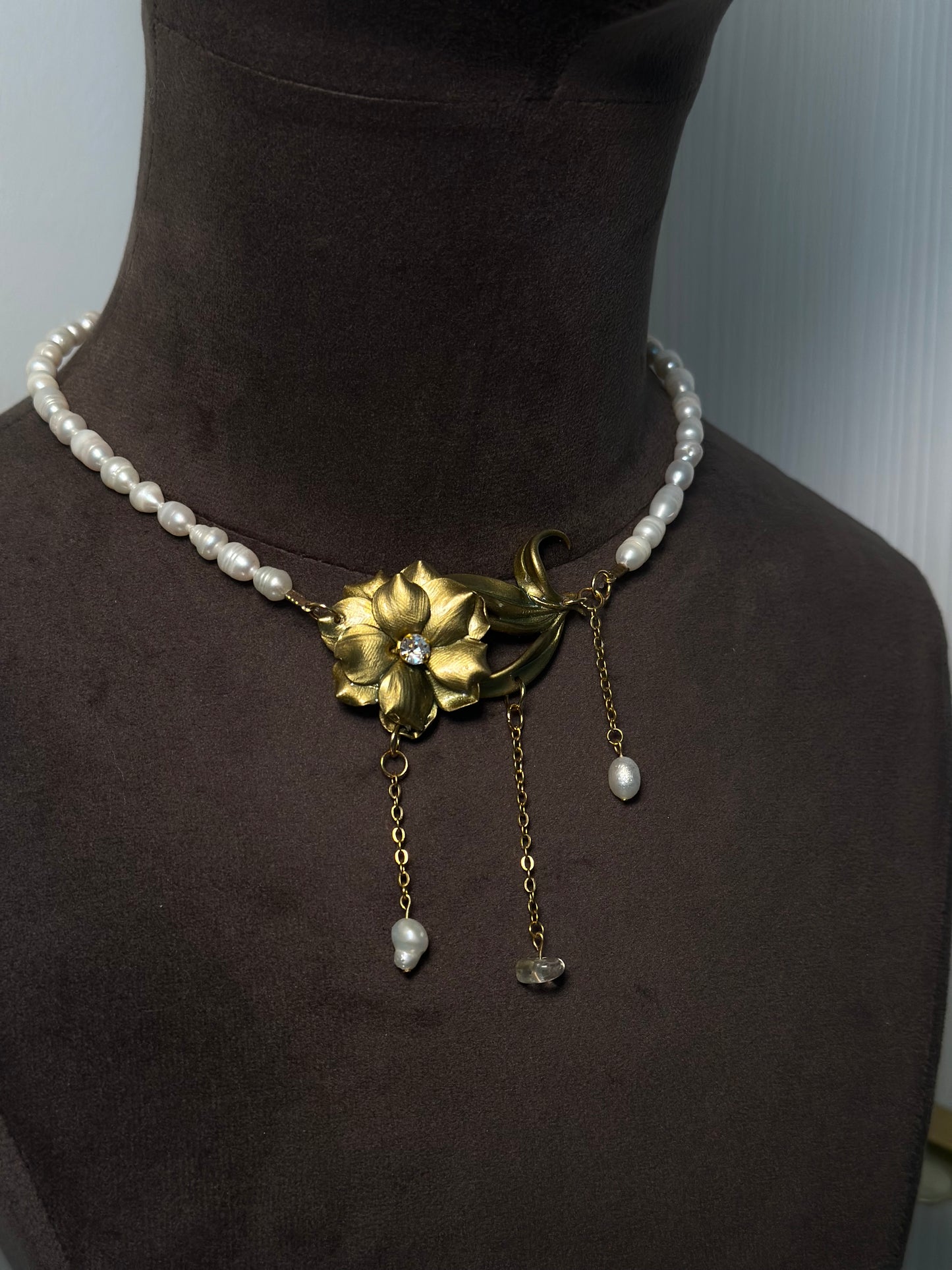 Pearl choker necklace with handcrafted gold flower centerpiece and cascading drops, unique statement jewelry for special occasions