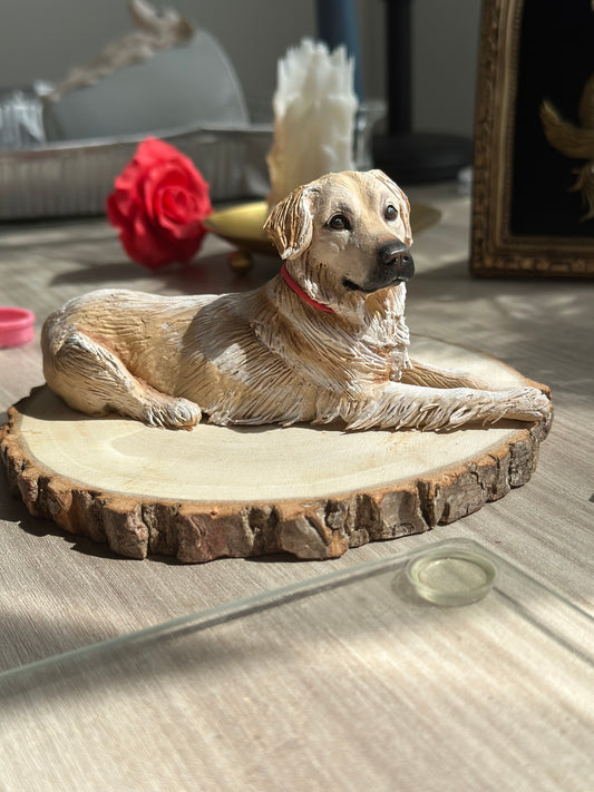 Realistic custom sculpture of a Golden Retriever lying down, handmade in polymer clay on a wooden base — perfect personalized pet memorial gift.
