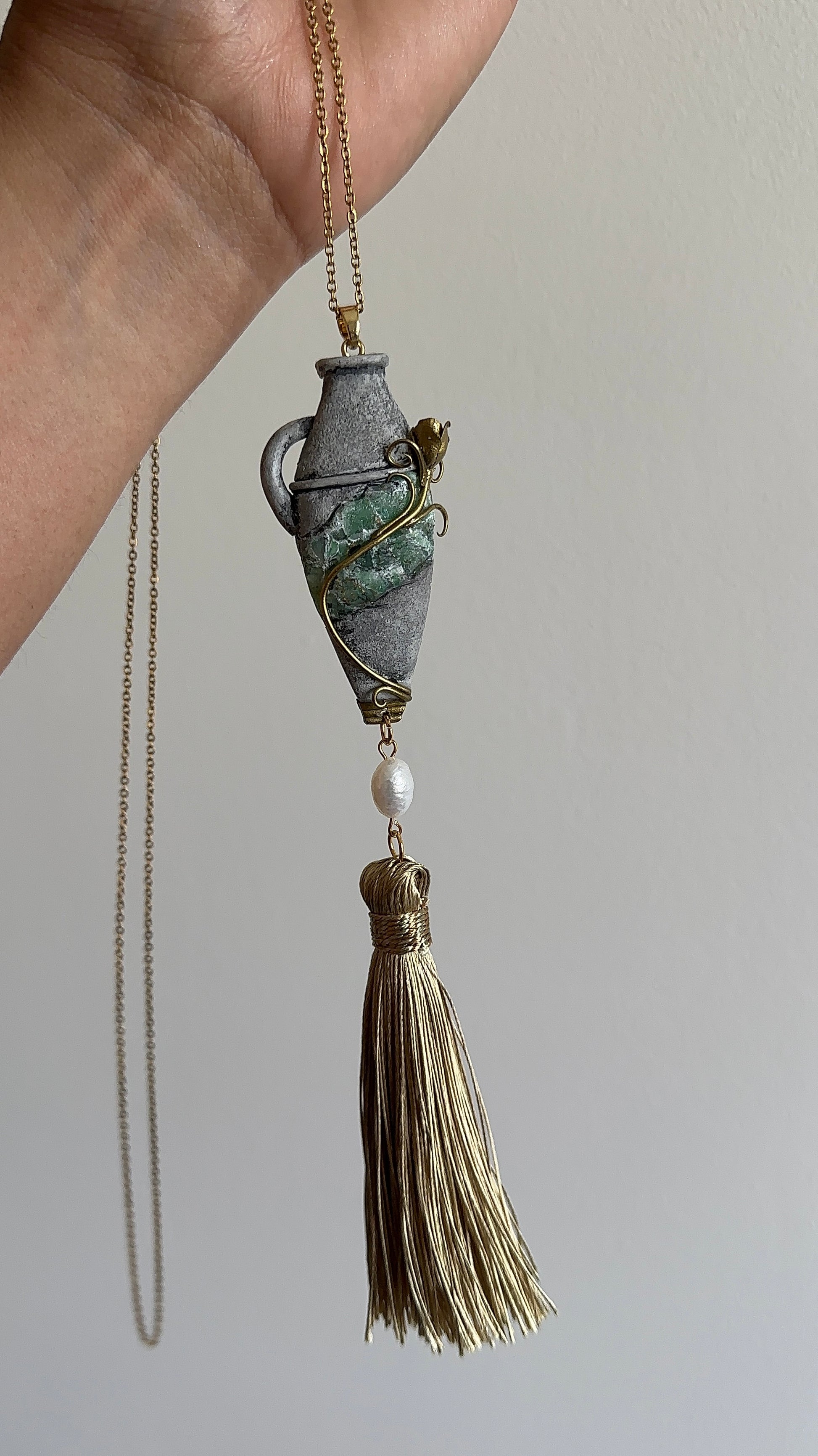     One-of-a-kind vessel tassel necklace with handmade polymer clay pendant, pearl detail and artistic green accent, sculptural jewelry for collectors