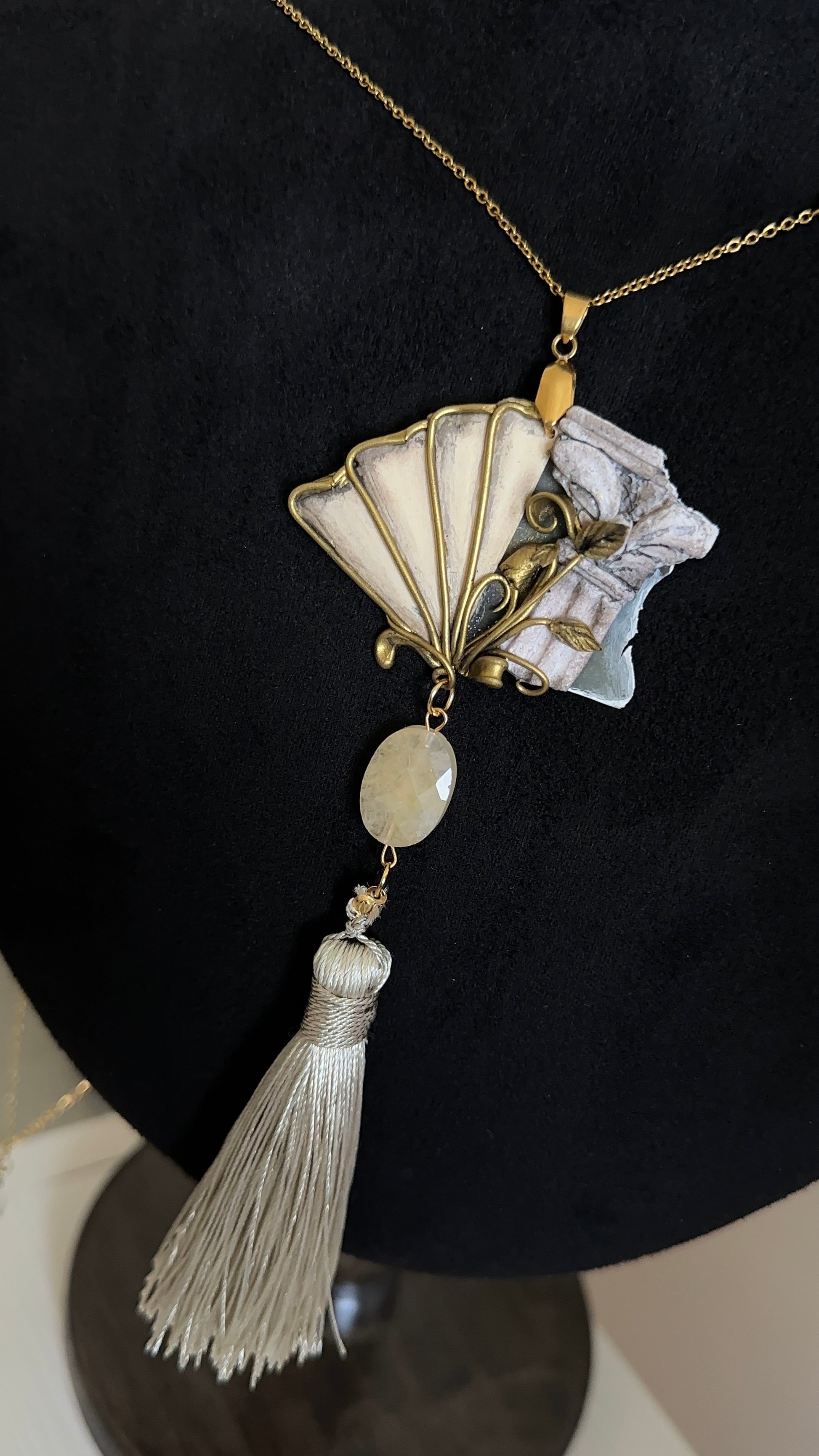     Handmade wearable relic tassel necklace with sculptural fan pendant, antique-inspired textures and soft tassel for elegant unusual outfits.