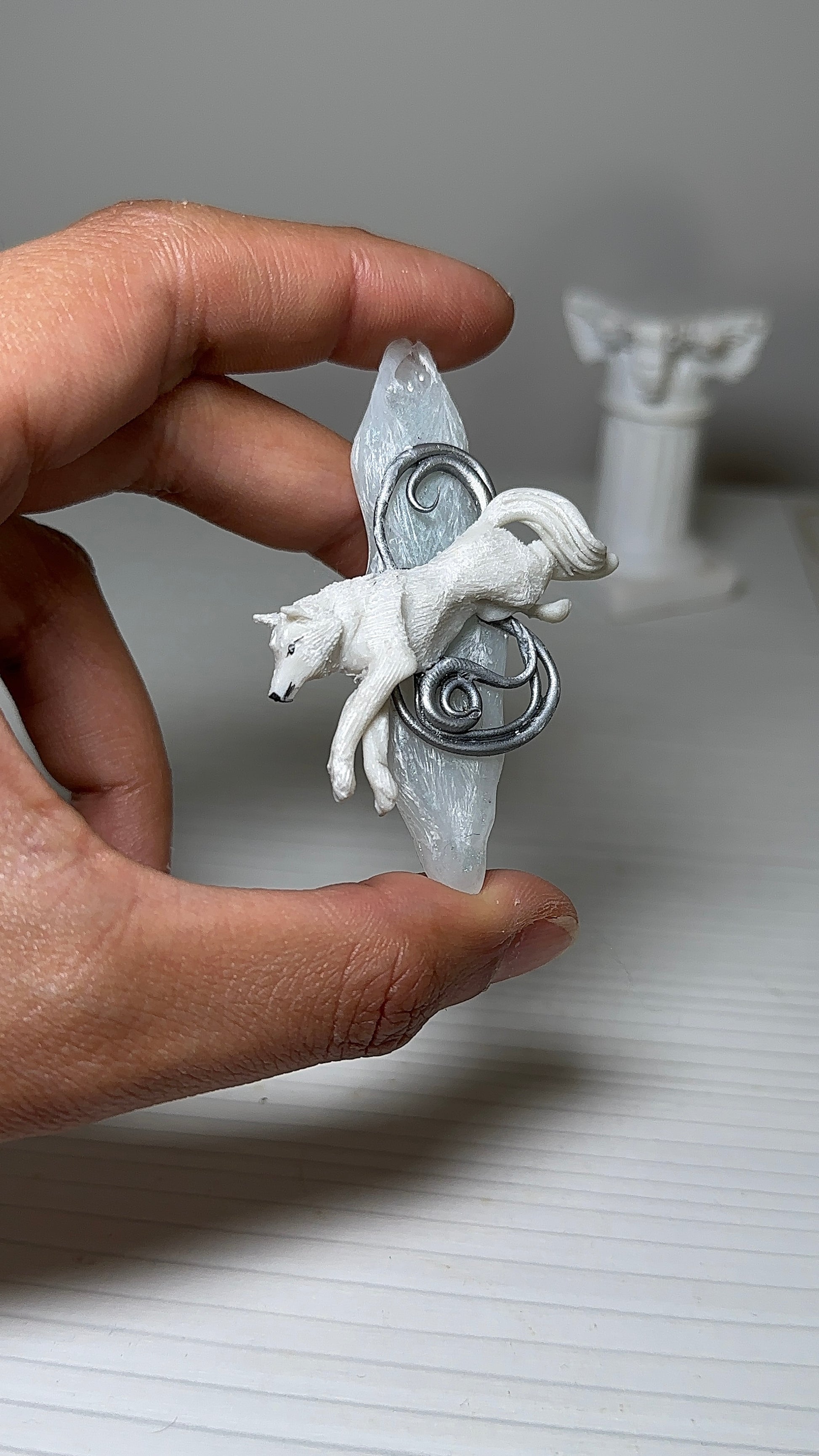 High-end handcrafted brooch with a wolf sculpture and ice-textured resin, perfect for seasonal wardrobe curation.