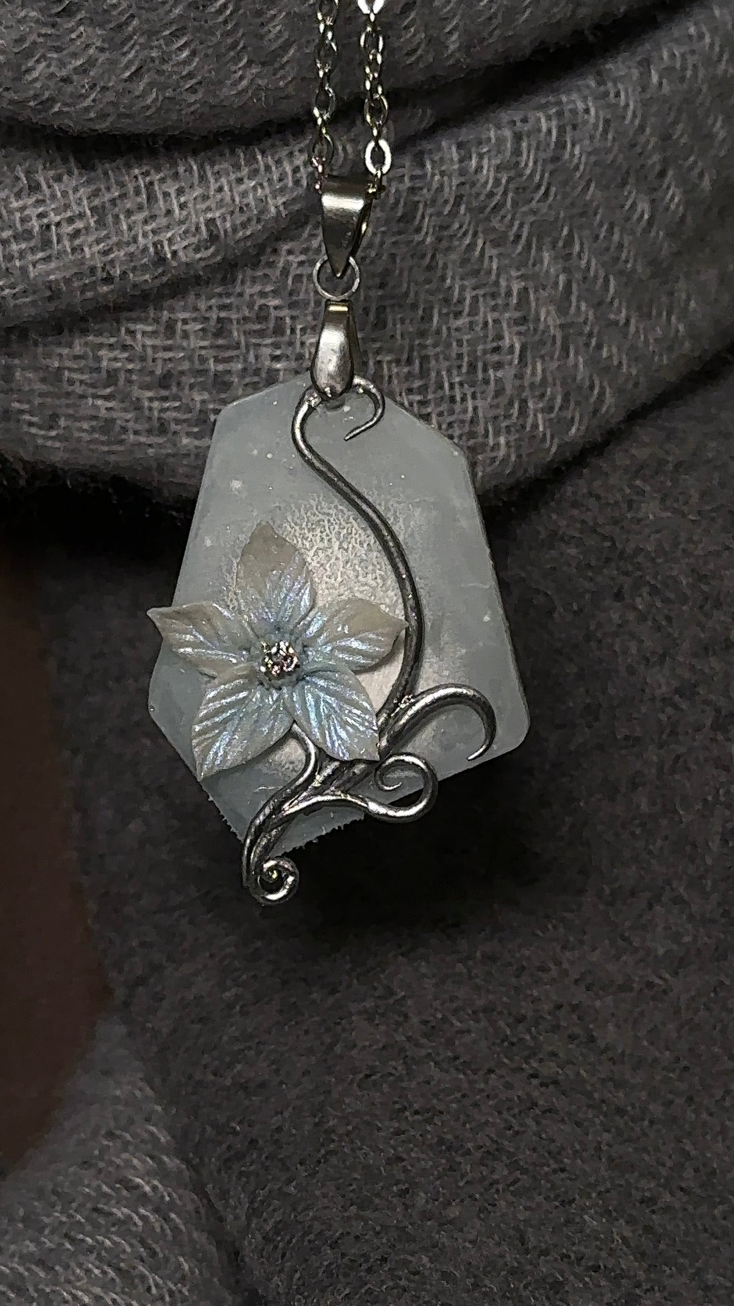 Sculpted winter flower pendant necklace in cold silver tones, rare artistic jewelry for collectors of original accessories