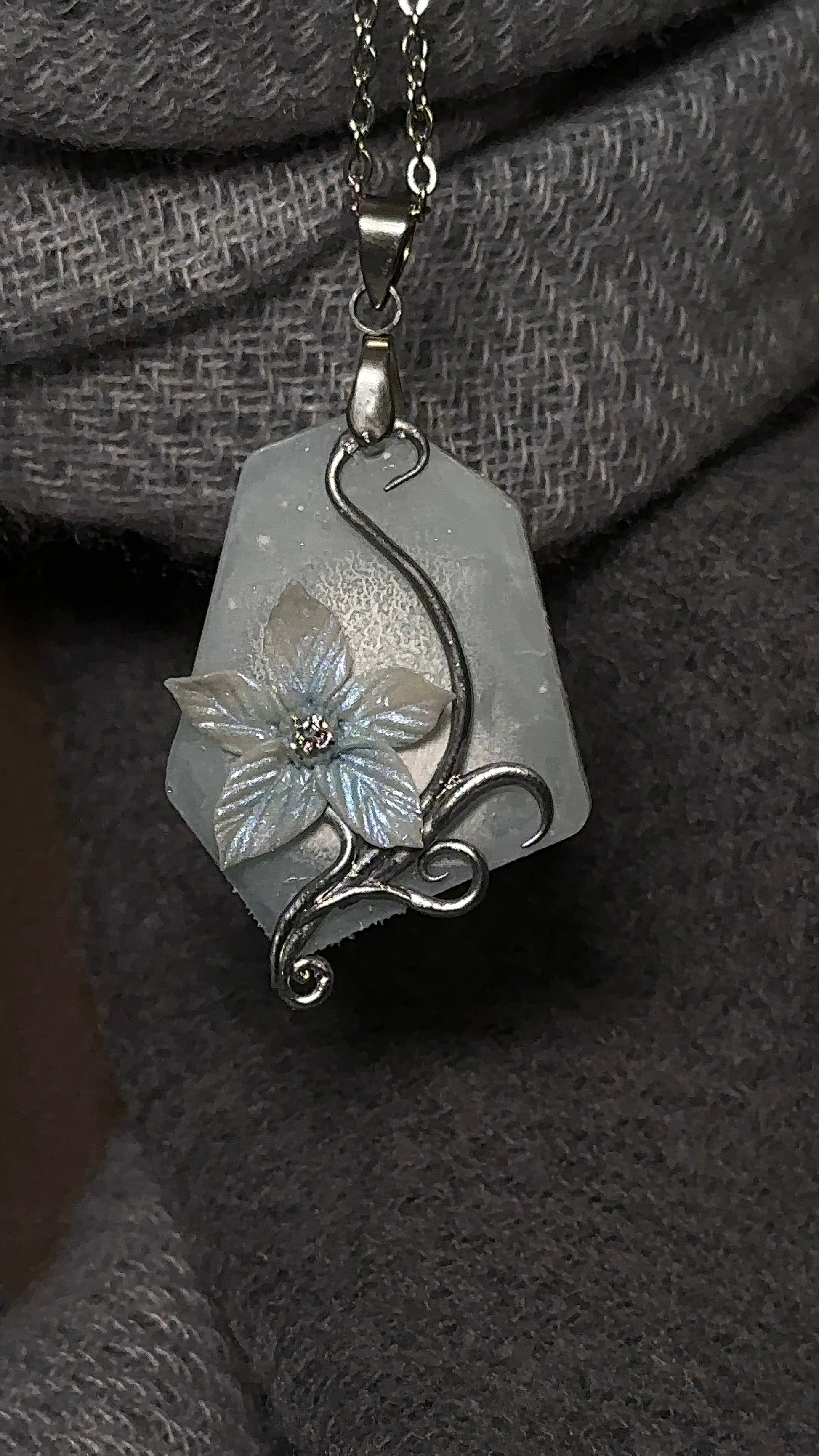 Sculpted winter flower pendant necklace in cold silver tones, rare artistic jewelry for collectors of original accessories
