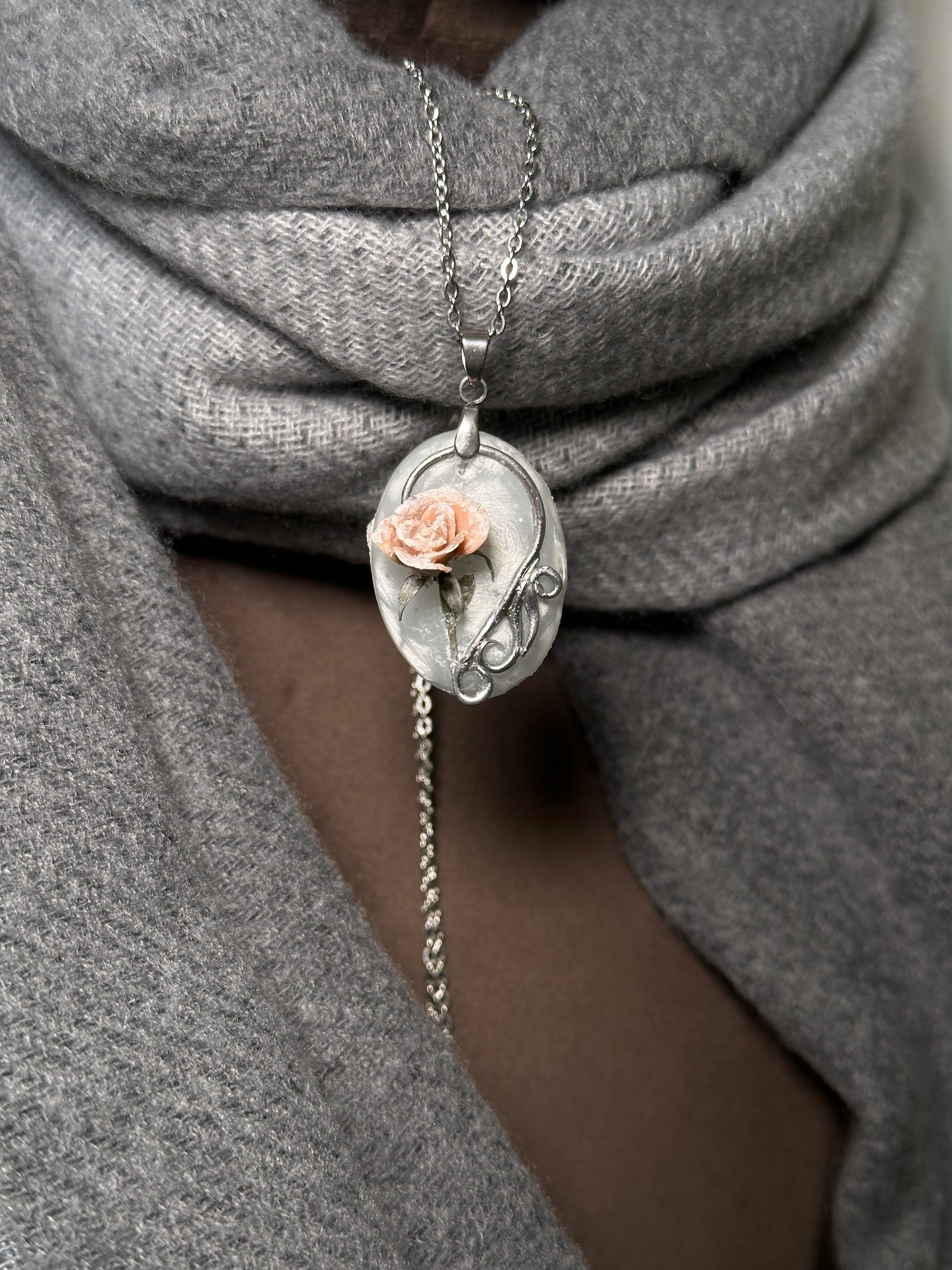 Sculpted blush rose pendant necklace in icy tones, distinctive collector jewelry for lovers of rare accessories