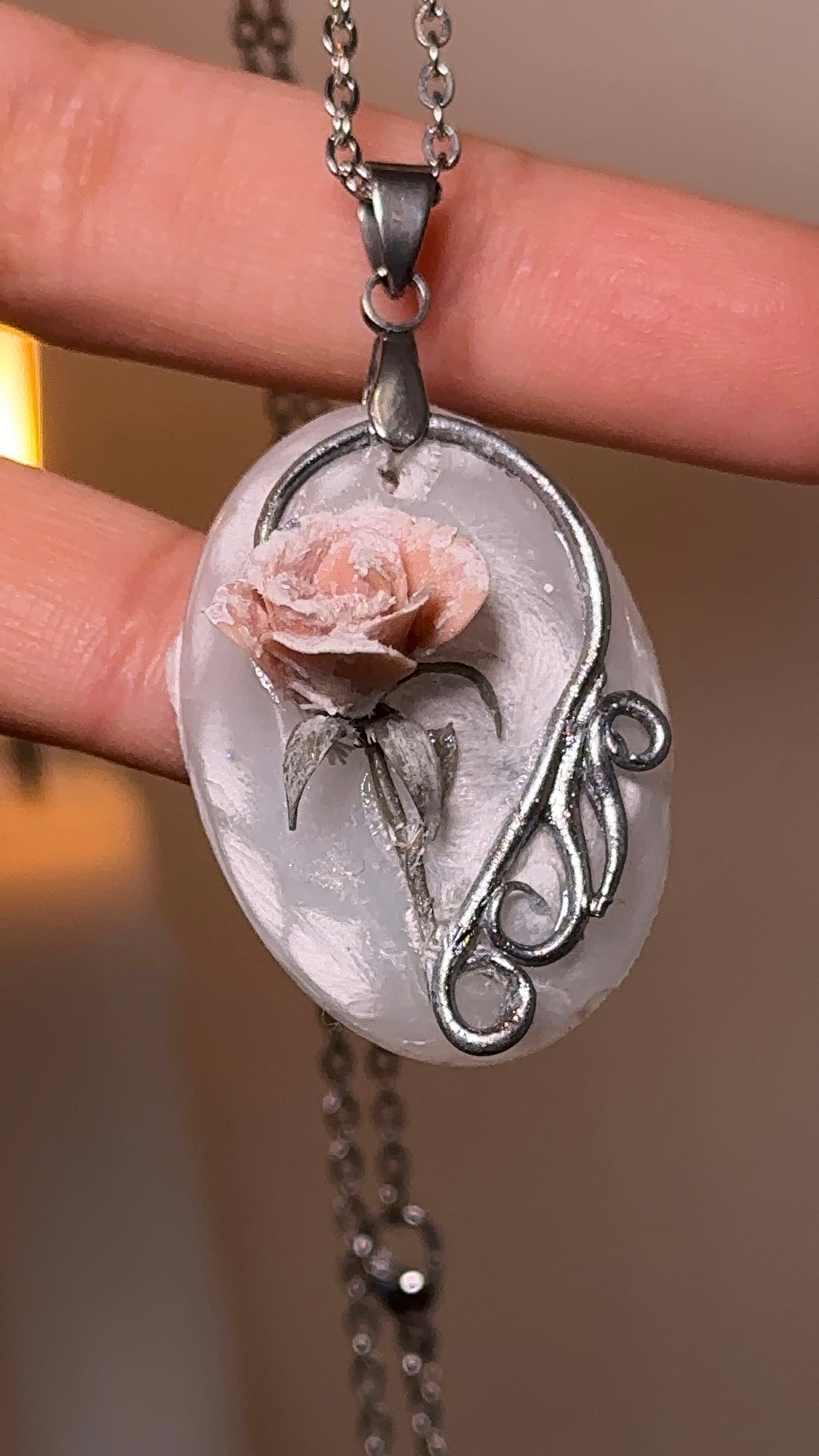 Blush winter rose necklace styled as elegant statement accessory for curated wardrobes and GRWM outfit videos